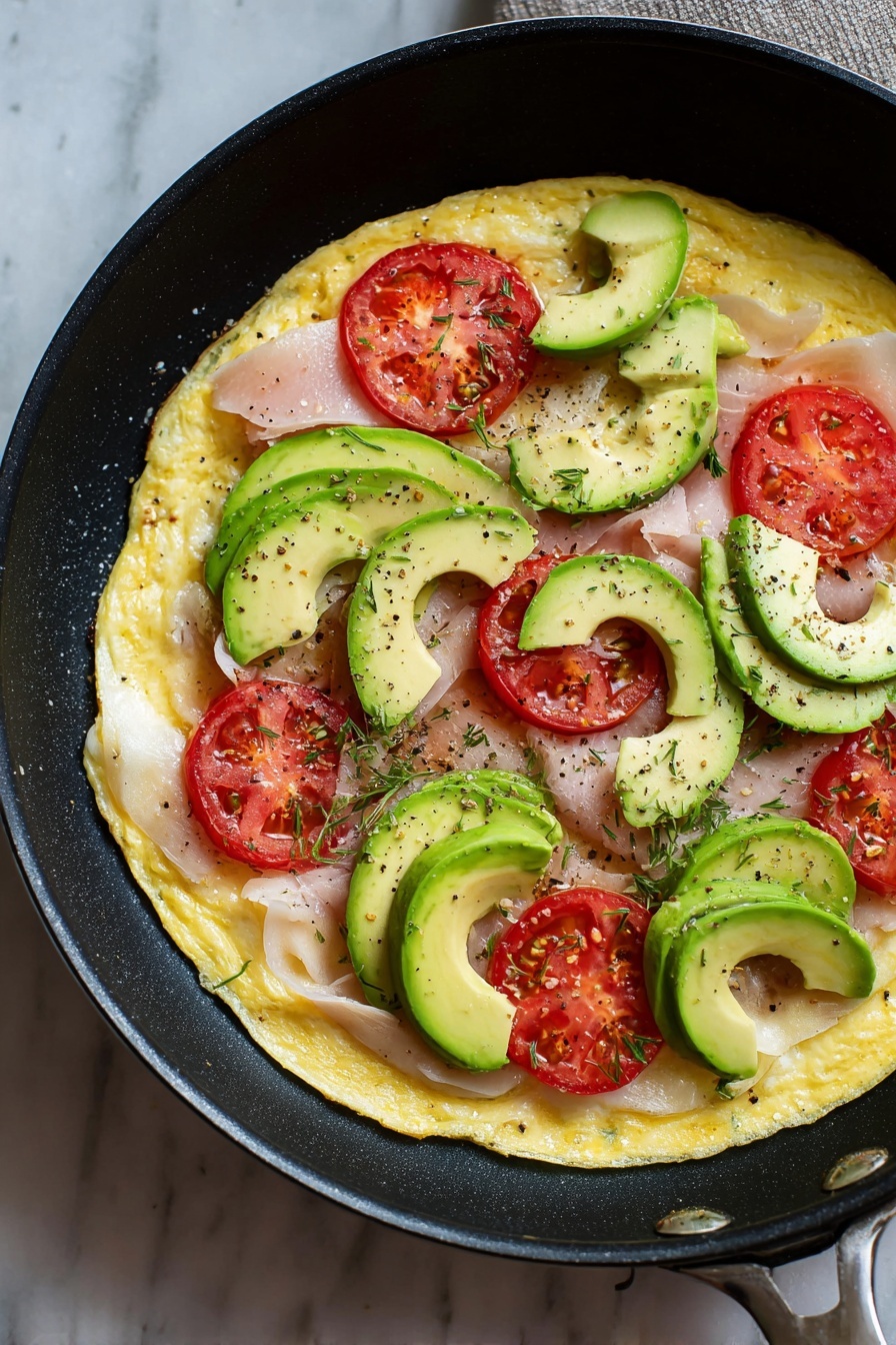 Turkey Avocado Egg Wrap, healthy breakfast wrap, quick breakfast ideas, protein-packed breakfast, easy egg wrap recipes - The image shows a close-up of a rolled wrap cut in half and stacked, placed on a white plate with a few green leaves. The wrap has multiple layers: a soft, yellow outer egg layer wrapped around slices of white deli meat, bright red tomato slices, fresh dark green spinach leaves, and light green avocado slices inside. The textures range from smooth egg to the slightly wrinkled meat, juicy tomato, and crisp greens. The background is a white marbled texture. photo taken with an iphone --ar 2:3 --v 7